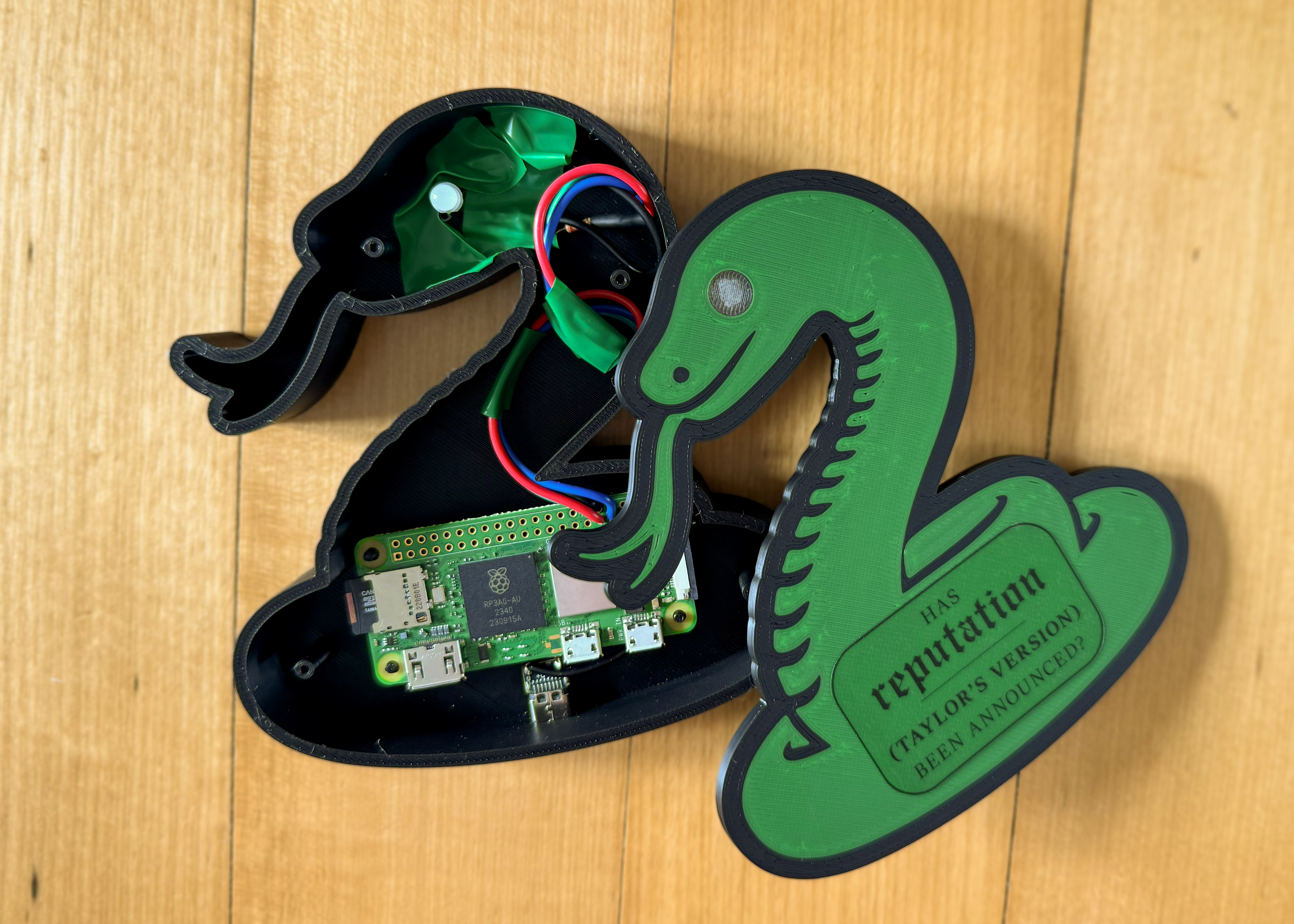 The fully assembled reputation alarm, in a 3D-printed case